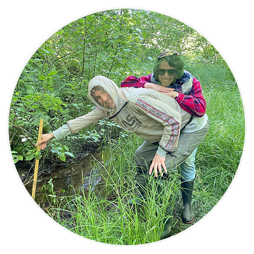 volunteers by the stream